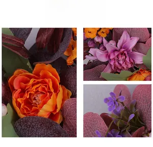 Detailed macro view of silk autumn wreath featuring orange peonies and burgundy berries