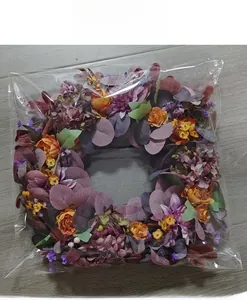 Autumn artificial flower wreath packaged in a transparent protective bag for shipping
