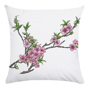 Close-up of pink peach blossom and bird pattern on soft white decorative pillowcase