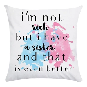 Detail of soft pillowcase featuring blue and pink watercolor art and sisterhood quote