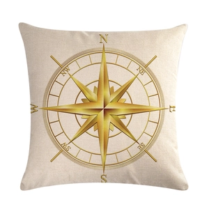 Detail of square linen pillowcase with golden compass print and woven texture