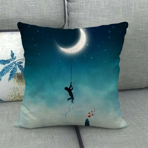 Detail of linen cushion cover featuring a moon and star digital print on a sofa