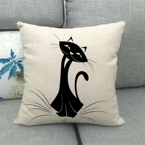 Close-up of minimalist black cat silhouette on textured beige linen pillow cover