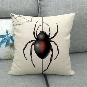Linen square throw pillow cover featuring a black spider and web on grey sofa