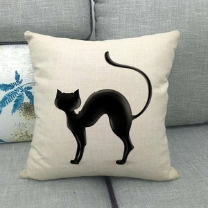 Linen blend square pillow cover featuring a black cat silhouette on a gray sofa