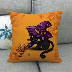 Detail of Halloween throw pillow cover with a black cat, wizard hat and pumpkin design