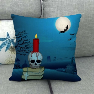 Detail of Halloween linen pillowcase featuring gothic skull, candle, and R.I.P tombstone