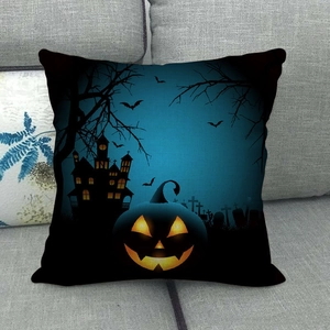 Detail of Halloween linen pillowcase featuring silhouettes of spooky castle and lit pumpkins