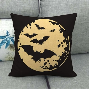 Detailed texture of black linen pillowcase with golden moon and bats Halloween design