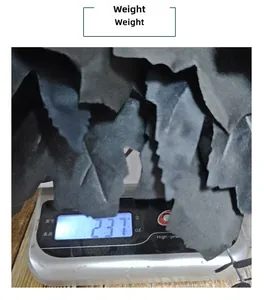 Detailed view of black Halloween maple leaf decorations on a scale weighing 237 grams