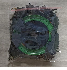 DIY Halloween wreath kit with black maple leaves and green round plastic frame in polybag