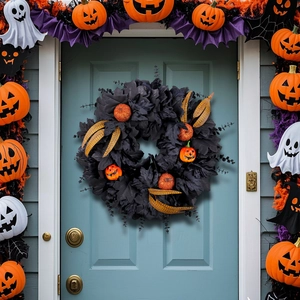 Halloween black maple leaf wreath with glitter pumpkins and feathers on a blue door