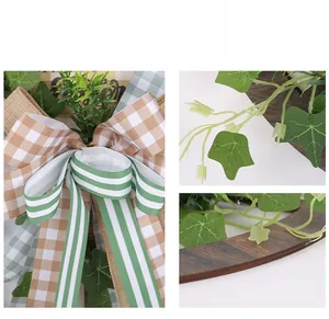 Detail of Easter wreath with plaid ribbons, faux ivy leaves, and wooden frame decor