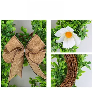 Detail view of burlap bow, white daisy, and natural vine base on Easter bunny wreath