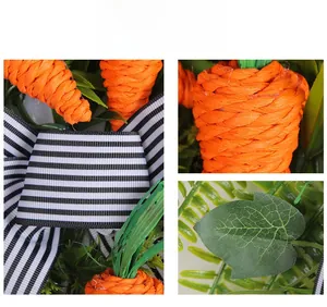Detail showing woven paper carrot and black striped bow on artificial Easter wreath