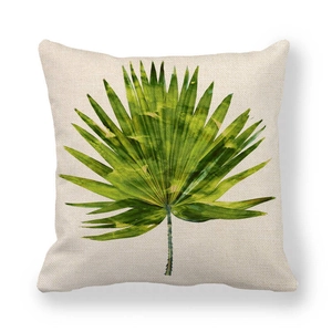 Detailed macro view of the natural linen texture and green watercolor palm leaf pattern
