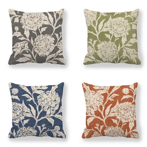 Close-up of four floral linen pillowcases in charcoal, olive, indigo, and rust colors