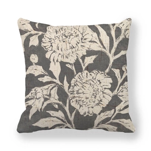 Detailed texture of linen throw pillow cover with hand-painted white floral pattern