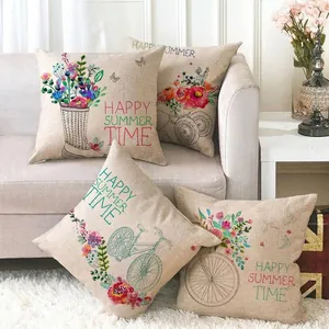 Set of 4 linen cushion covers featuring summer bicycle and flower designs on a sofa