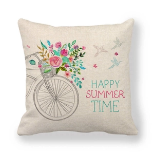 Detail showing linen fabric texture and colorful bicycle floral print with summer text