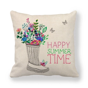 Detail of linen pillowcase featuring a floral rain boot and Happy Summer Time text