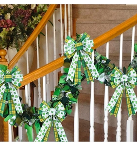 Detail of St. Patrick's Day green bow garland on wooden staircase railing decoration