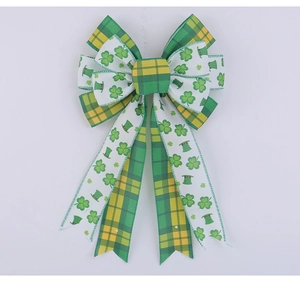 Detail of St. Patrick's Day bow with shamrock patterns and green yellow plaid ribbons