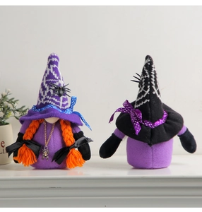 Detail of two Halloween plush gnomes with purple hats, spider decor and orange braids
