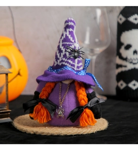 Detail of Halloween gnome plush with spider patterns, purple knit hat and orange braids