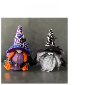 Detail of Halloween gnome plush dolls with purple hats, spider charm and orange braids
