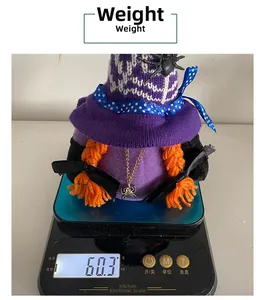 Detailed weight measurement showing 60.3g for a Halloween faceless plush doll
