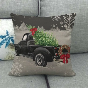 Christmas pillow cover featuring vintage truck and tree on a cozy linen fabric texture