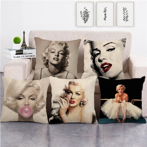 Set of five Marilyn Monroe watercolor linen throw pillow covers on a beige sofa