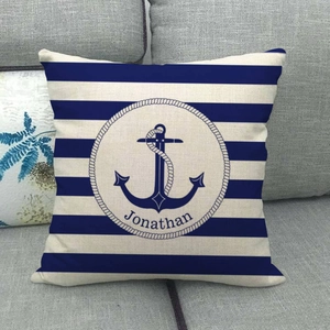 Detail of nautical anchor linen pillow cover with blue stripes and personalized text