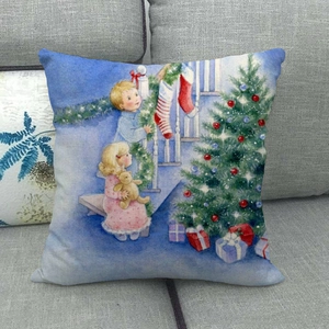 Linen Christmas pillow case with hand-drawn festive tree and children on gray sofa