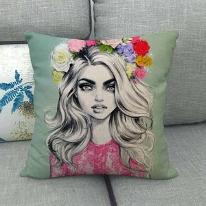 Detailed texture of linen pillowcase featuring a floral girl illustration on a grey sofa