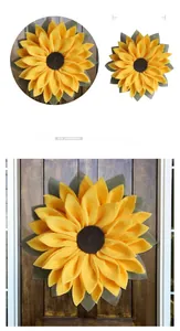 Detail showing 42cm sunflower door wreath with vibrant yellow petals and green leaves