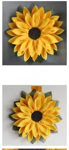 Detailed view of handmade fabric sunflower decor with yellow petals and brown center