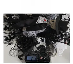 Detailed weight measurement of Halloween skeleton wreath showing 278 oz on a scale
