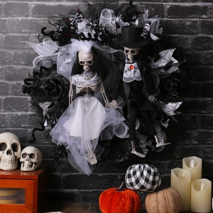 Halloween wreath featuring skeleton bride and groom dolls with black roses and tulle veils