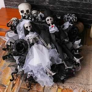 Gothic Halloween skeleton bride and groom wedding wreath with black roses and mesh veils