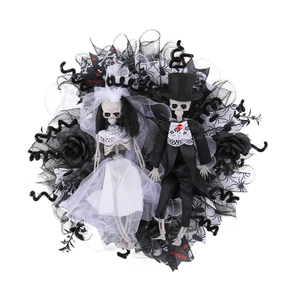 Halloween wreath featuring skeleton bride and groom dolls with black and white gauze mesh
