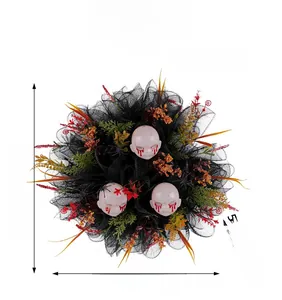 Detailed view of Halloween wreath with scary doll heads, mesh and dimensions 40x13cm