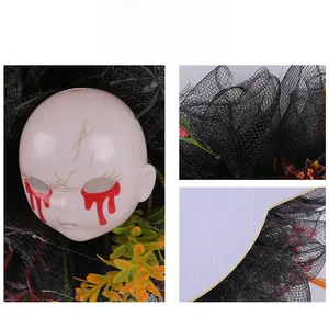 Detail shot of creepy bleeding doll head and black mesh on Halloween horror wreath