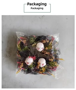 Detail of Halloween bloody ghost wreath packaging with black mesh and red floral accents