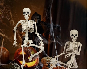 Detail of 40cm poseable plastic skeletons set in a spooky Halloween party scene