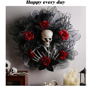 Macro detail of Halloween wreath featuring skull, red roses and black mesh texture