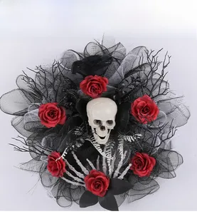 Detail of Halloween wreath featuring a white skull, red roses, and a black crow figure