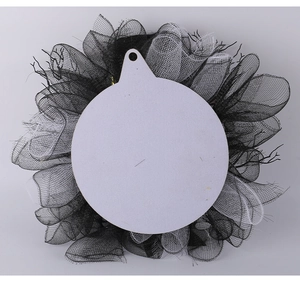 Detail of Halloween wreath back structure with layered black and white mesh and hanging base