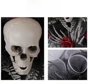 Detail of Halloween wreath with skull, red roses and skeleton hand for party decor